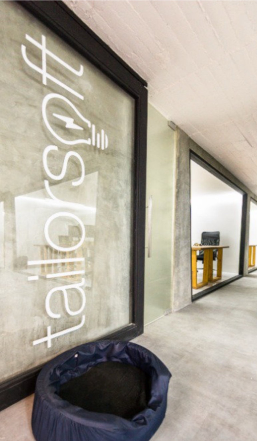 The Tailorsoft logo etched on the office door in Medellín
